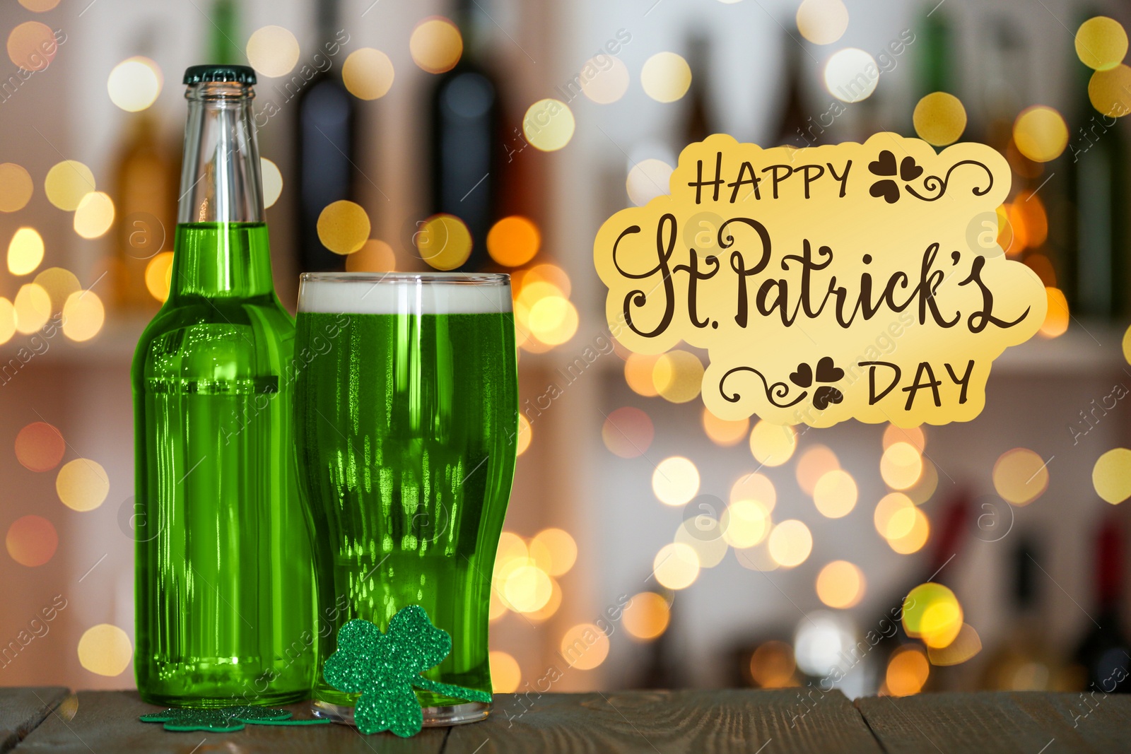 Image of Green beer and clover on wooden counter. St.Patrick's Day celebration