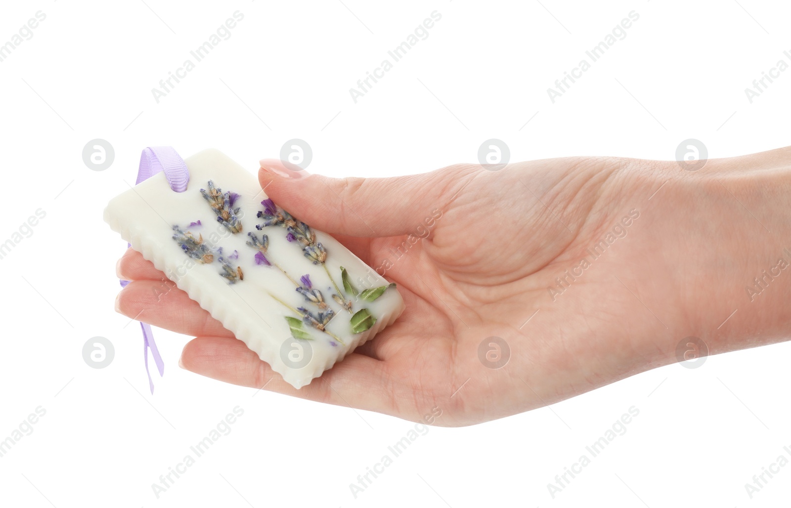 Photo of Woman holding scented sachet with flowers on white background, closeup