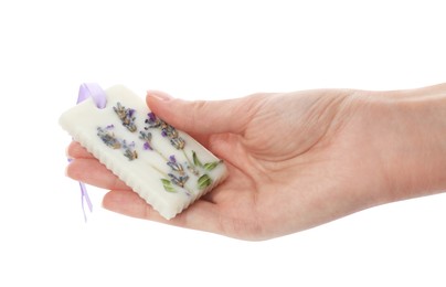 Woman holding scented sachet with flowers on white background, closeup