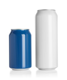 Photo of Aluminum cans with drinks on white background