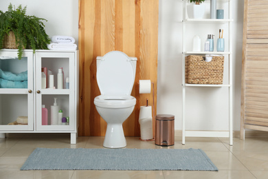Stylish toilet bowl in modern bathroom interior