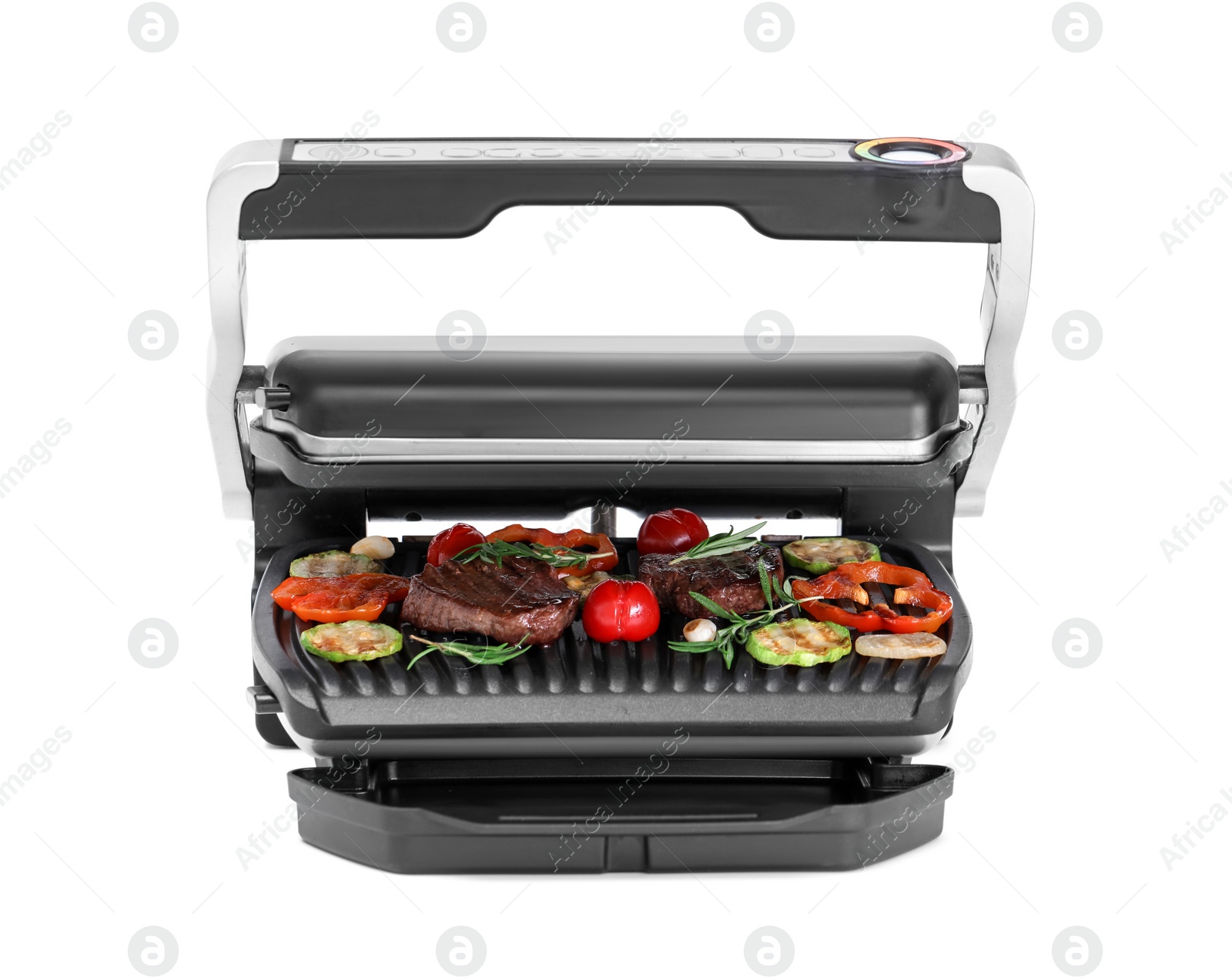 Photo of Electric grill with tasty meat, rosemary and vegetables isolated on white