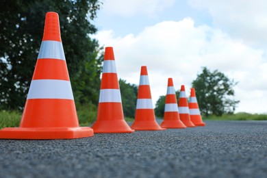 Photo of Traffic cones on asphalt highway. Road repair