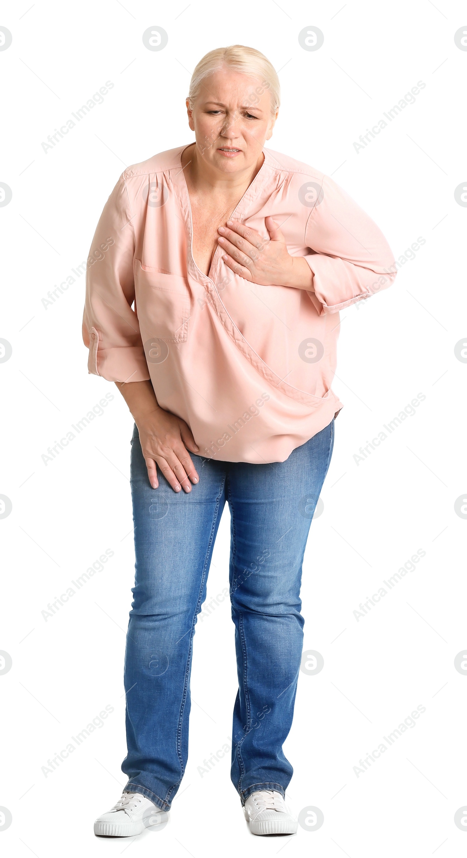 Photo of Mature woman having heart attack on white background