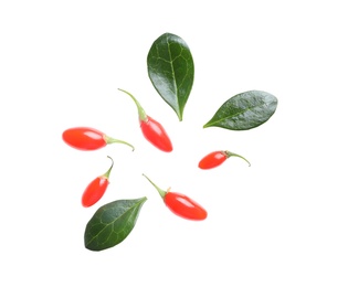 Photo of Fresh ripe goji berries and leaves on white background, top view