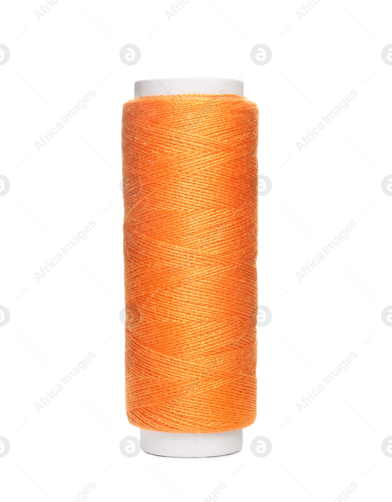 Photo of Spool of orange sewing thread isolated on white