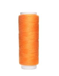 Photo of Spool of orange sewing thread isolated on white