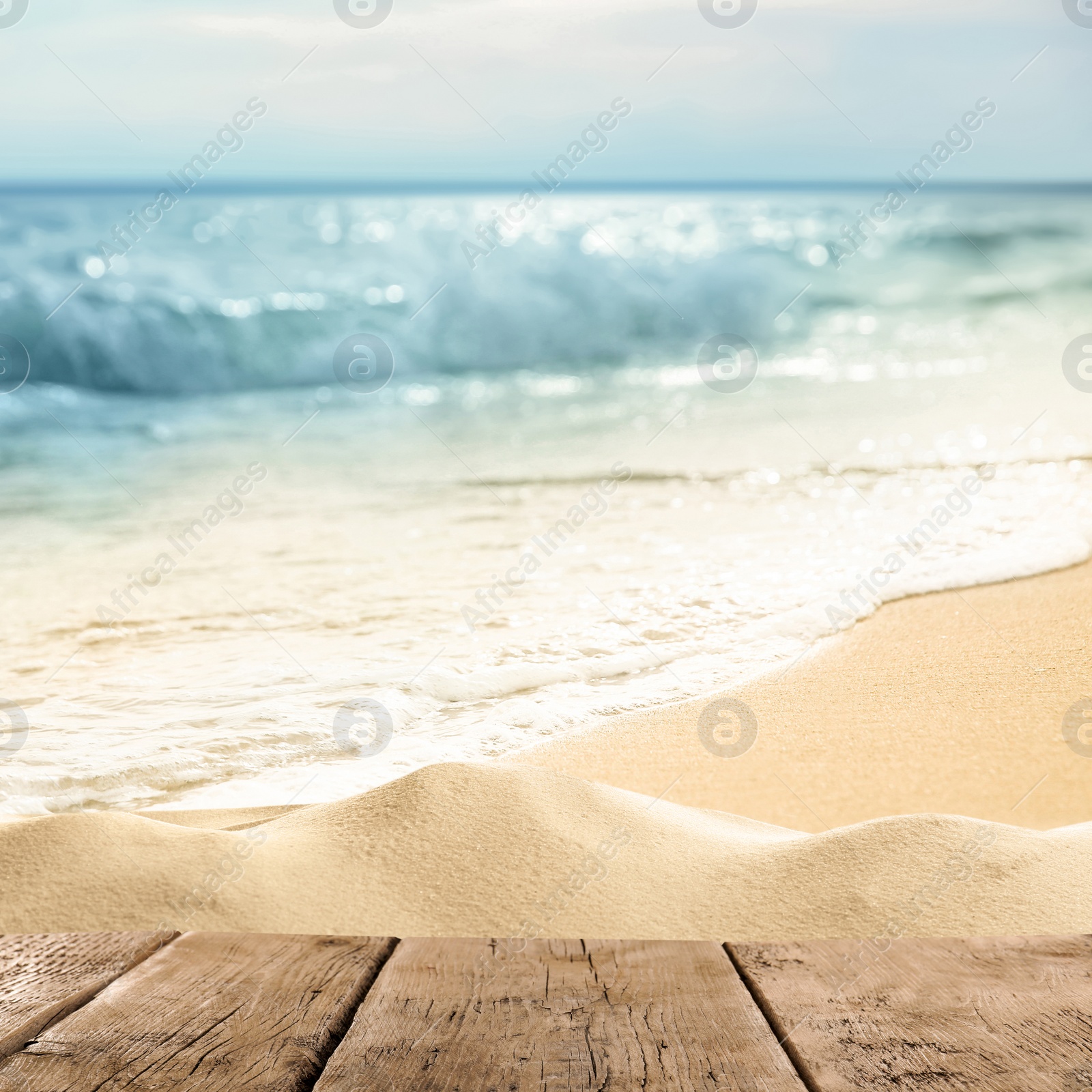 Image of Wooden surface on sandy beach near ocean