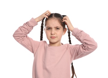 Photo of Little girl scratching head on white background. Annoying itch