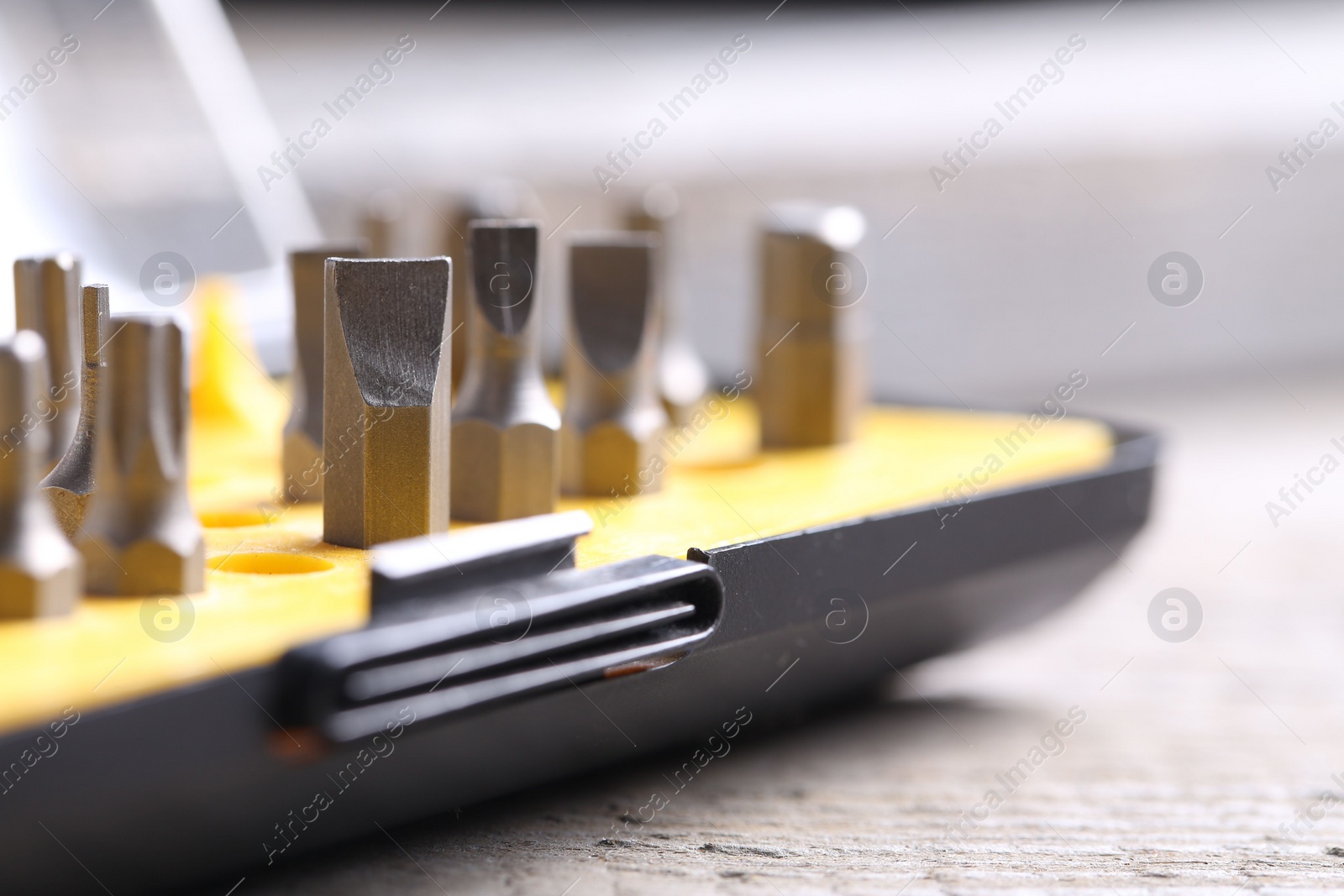 Photo of Screwdriver bit set on blurred background, closeup