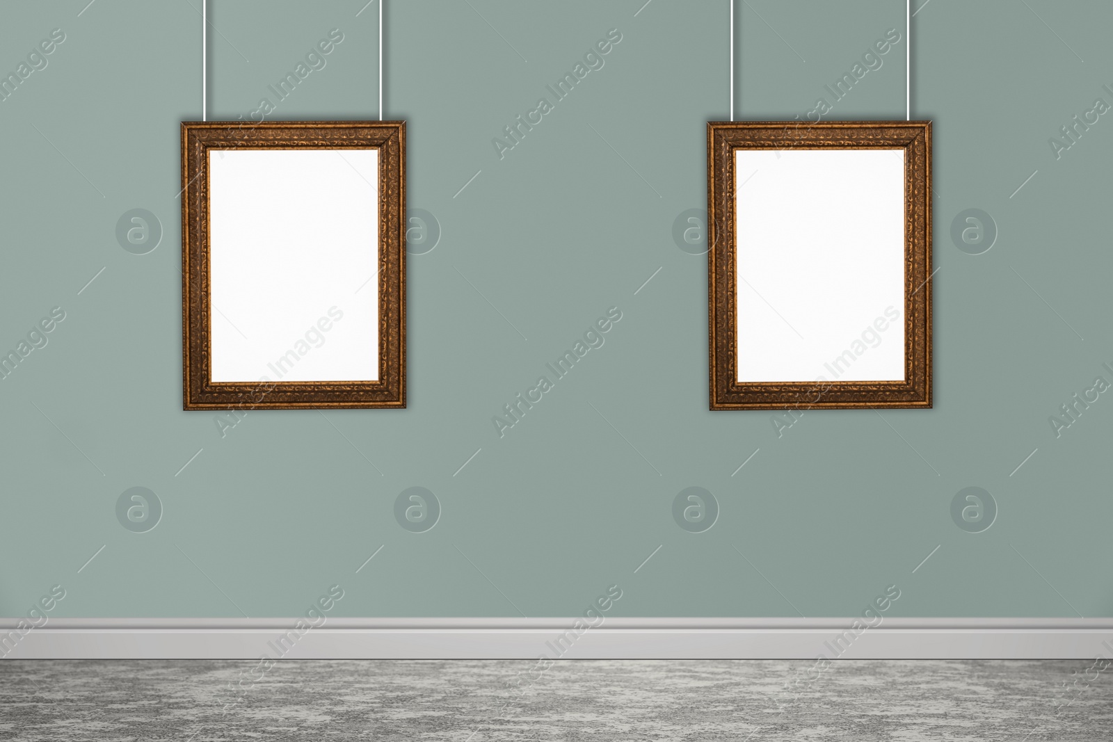 Image of Frames with empty canvases on grey wall in modern art gallery. Space for design