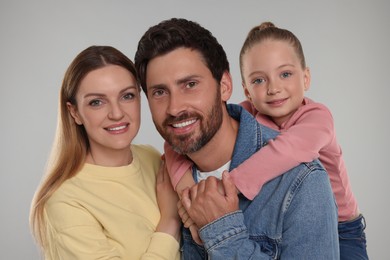 Photo of Portrait of happy family on light grey background