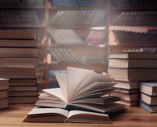 Image of Different books on wooden table in library