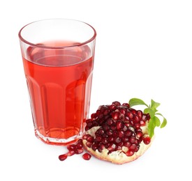 Photo of Refreshing pomegranate juice in glass, leaves and fruit isolated on white