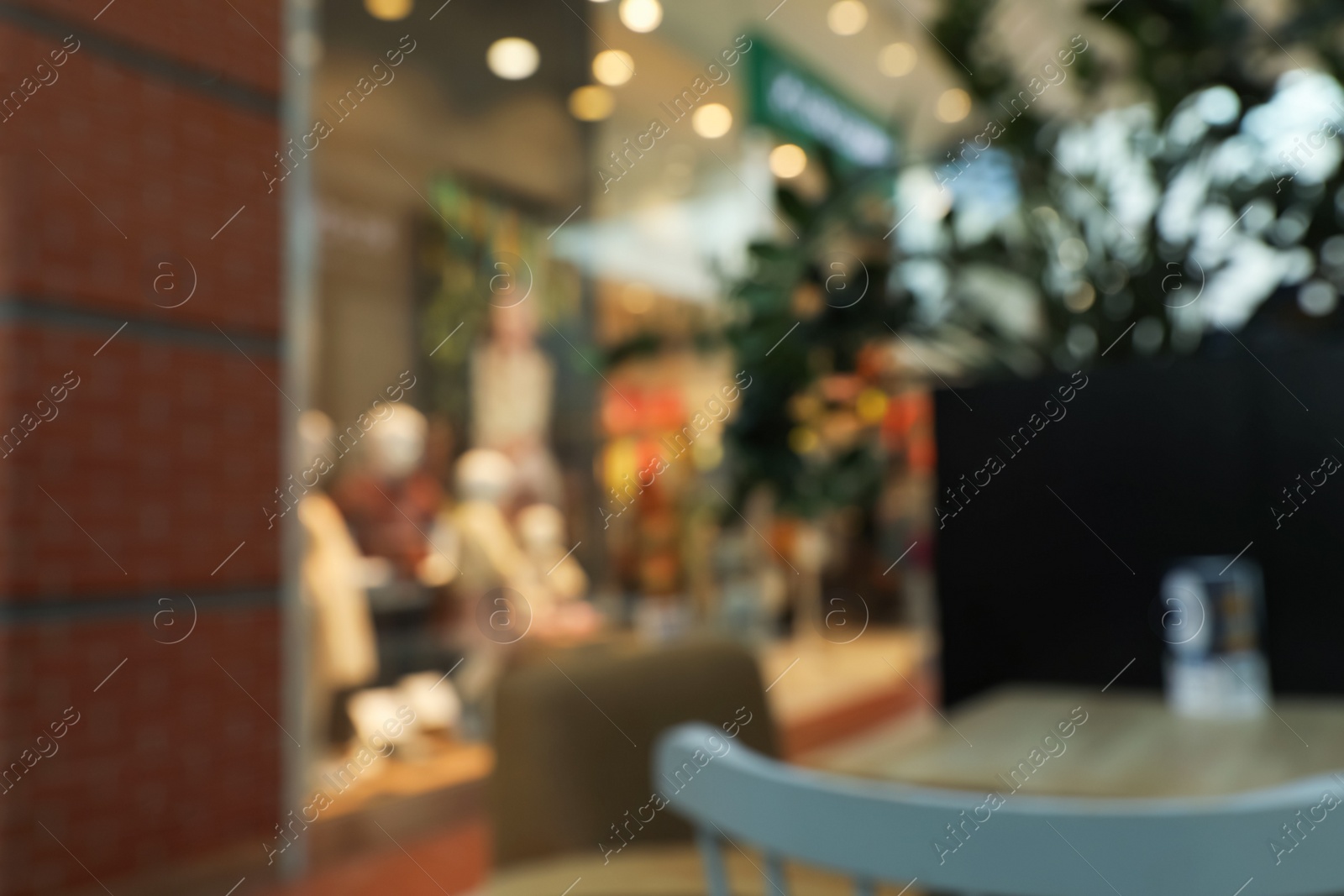 Photo of Blurred view of shopping mall interior. Bokeh effect