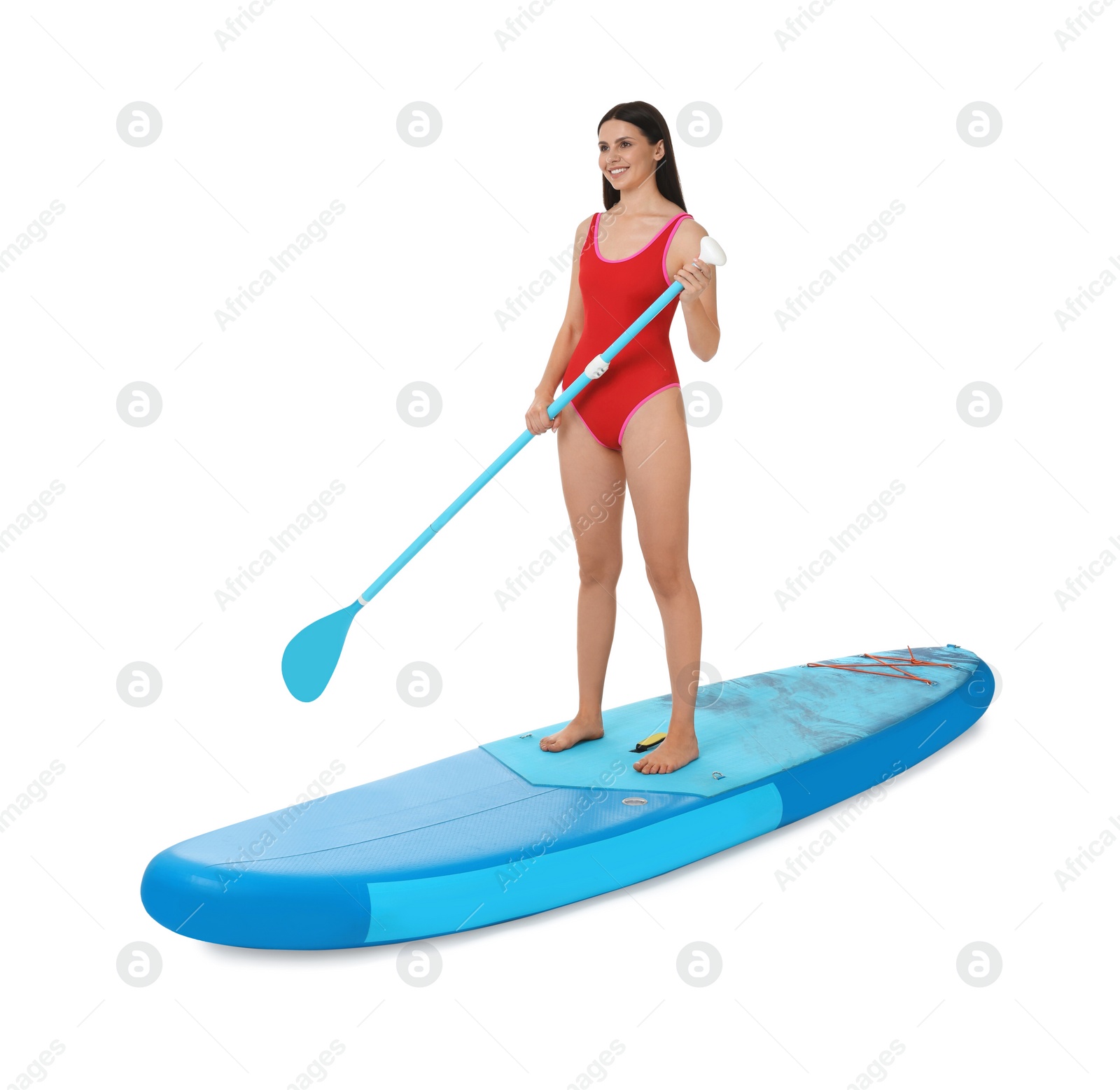 Photo of Happy woman with paddle on blue SUP board against white background