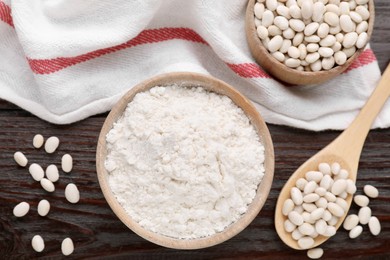 Photo of Kidney bean flour and seeds on wooden table, flat lay