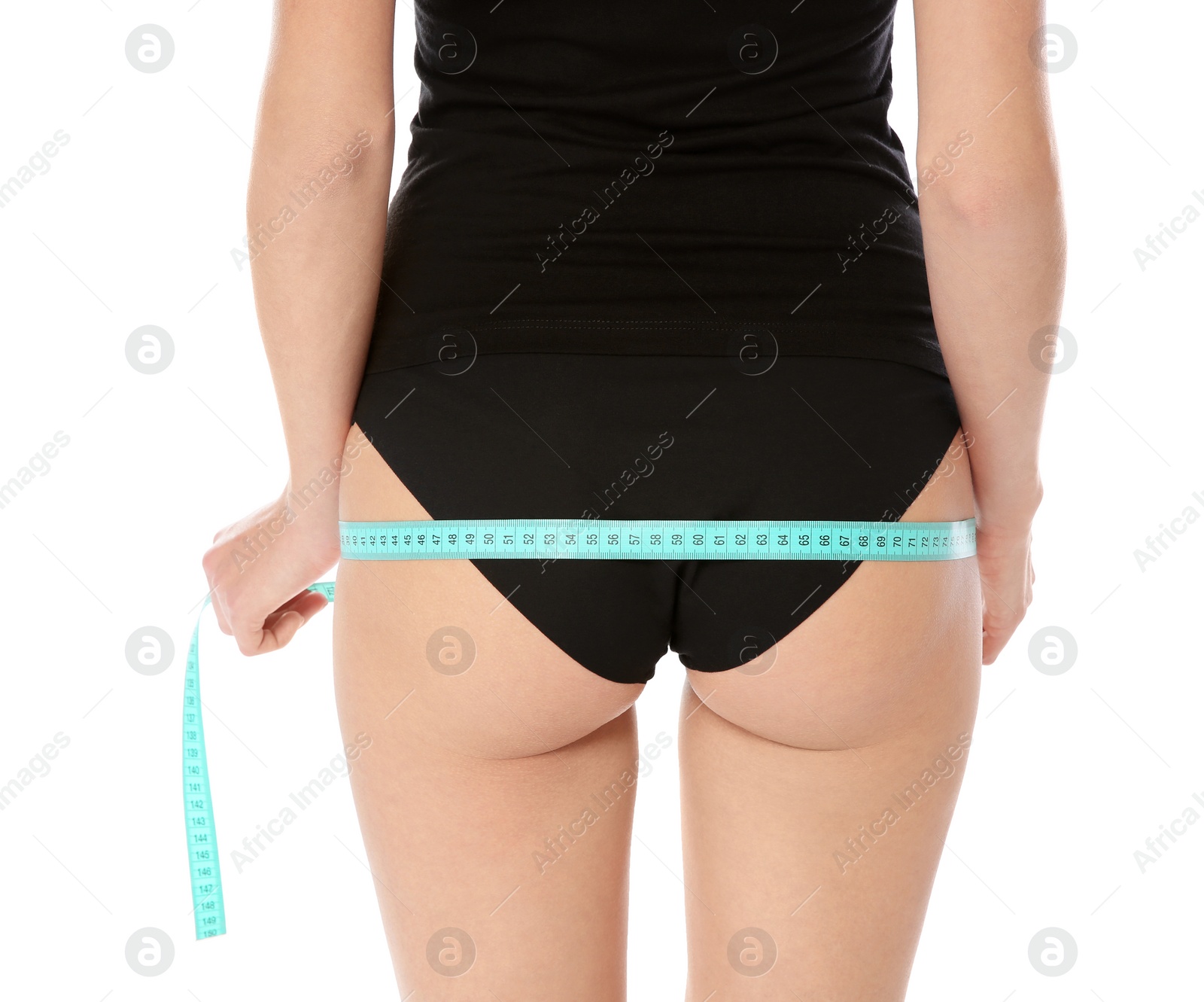 Photo of Slim woman measuring her hips on white background, closeup. Weight loss