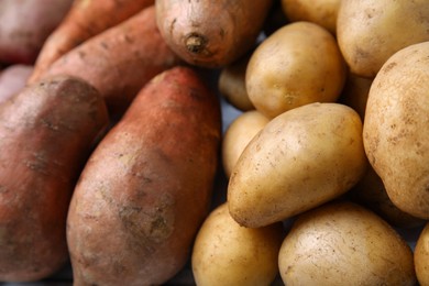 Photo of Different types of fresh potatoes, closeup view