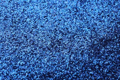 Beautiful shiny blue glitter as background, closeup