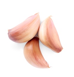 Fresh unpeeled garlic cloves on white background