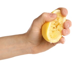 Photo of Woman squeezing lemon half on white background, closeup