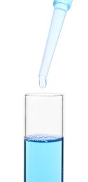 Photo of Dripping liquid from pipette into test tube isolated on white, closeup