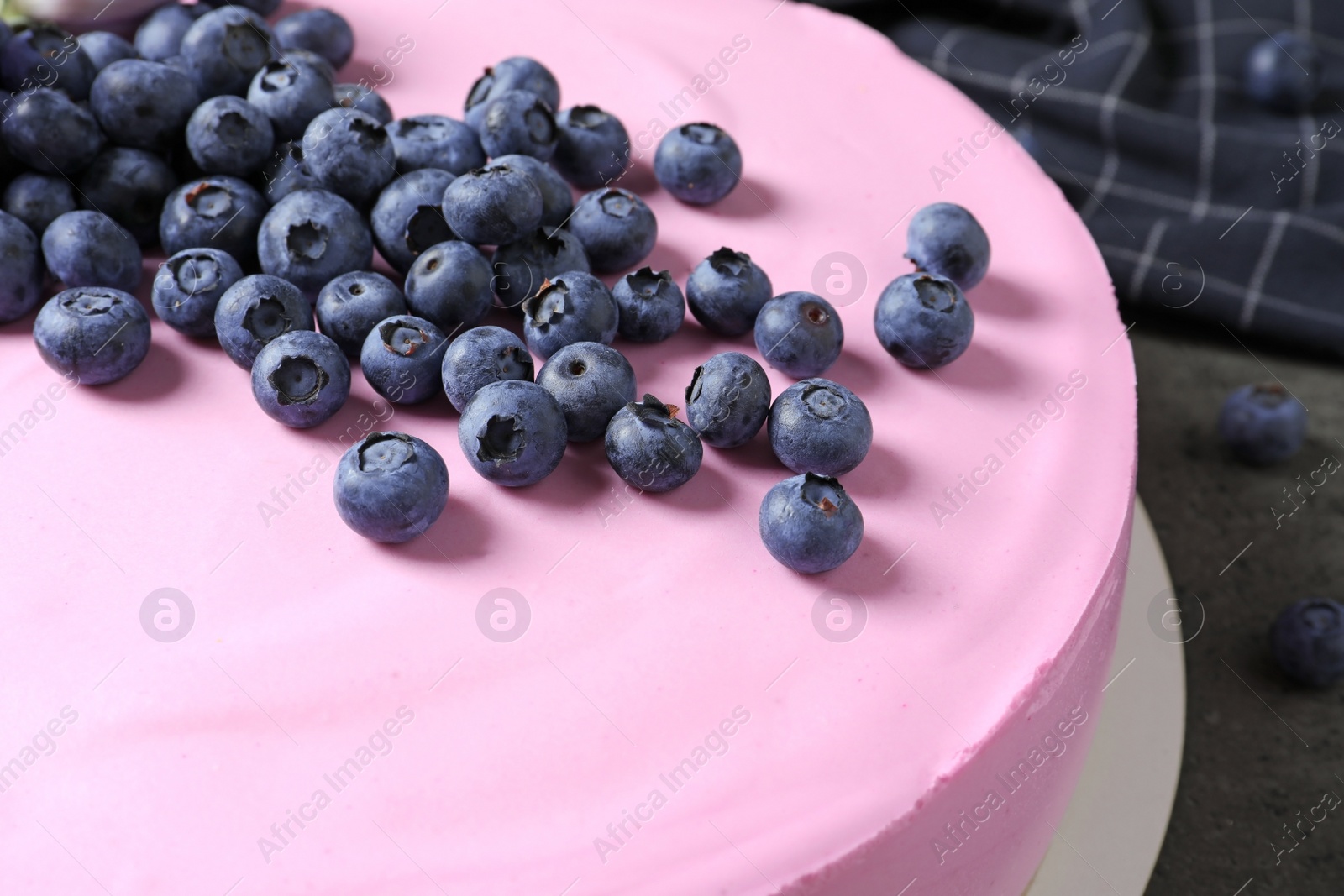 Photo of Tasty cheesecake with blueberries on table, closeup