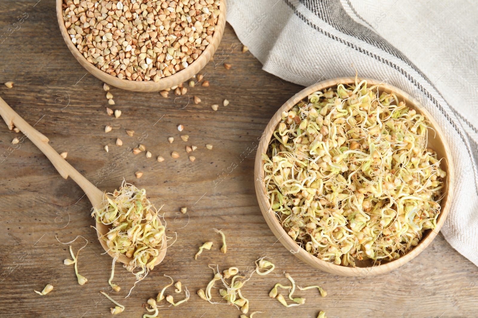 Photo of Flat lay composition with green buckwheat on wooden table