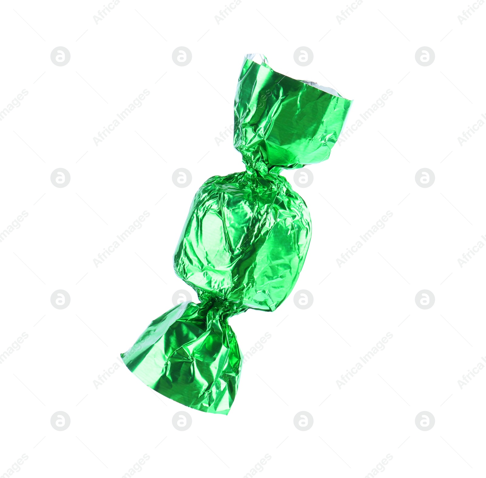 Photo of Tasty candy in green wrapper isolated on white