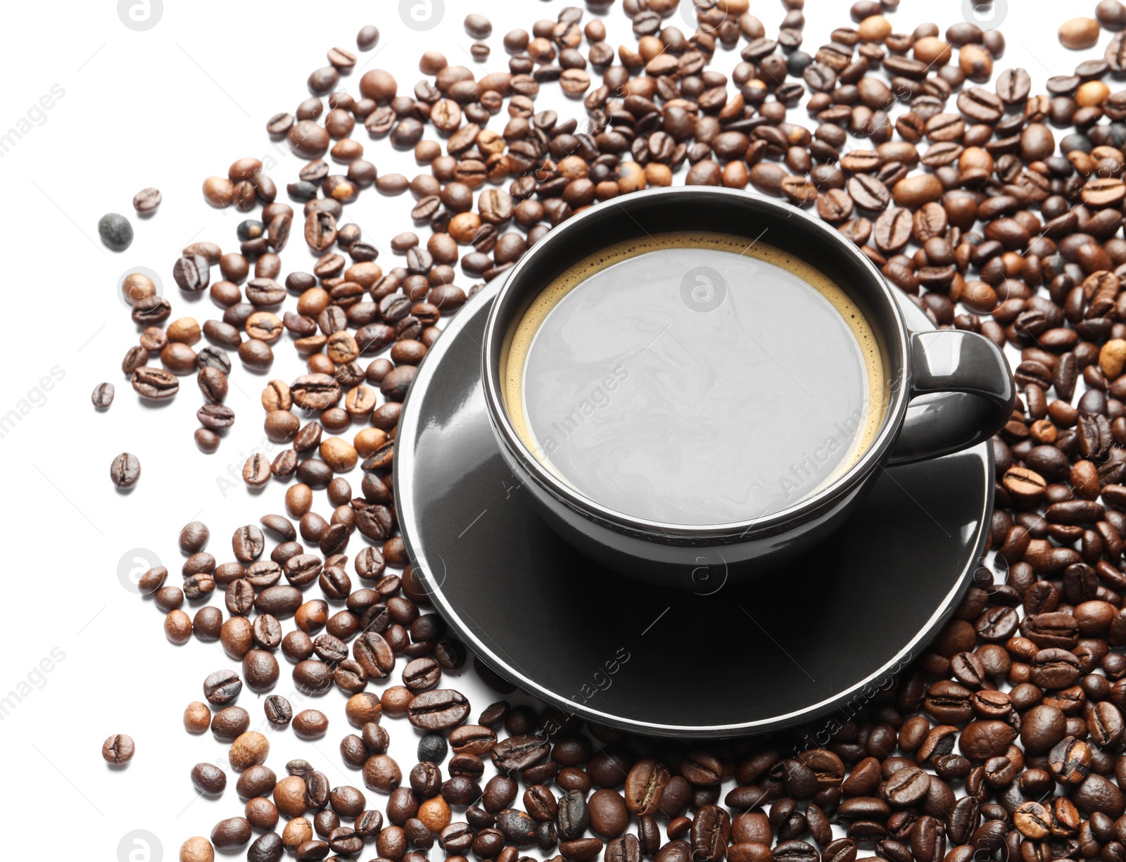 Photo of Roasted coffee beans and cup of hot beverage on white background