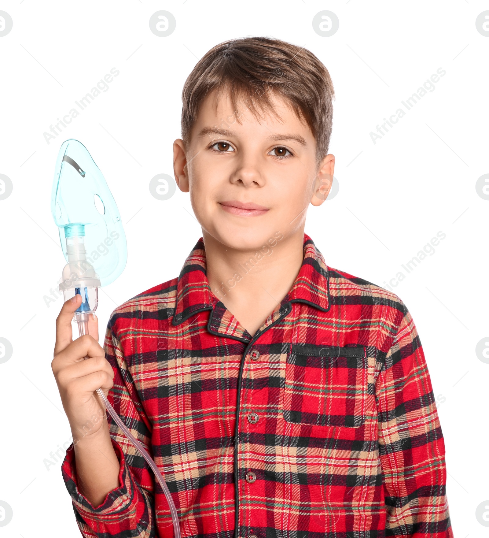 Photo of Boy holding nebulizer for inhalation on white background