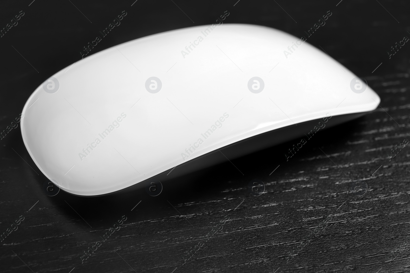 Photo of Wireless computer mouse on black background