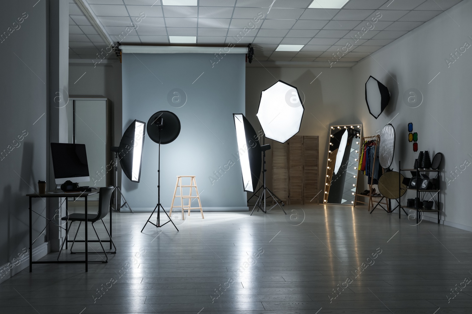 Photo of Interior of modern photo studio with professional equipment