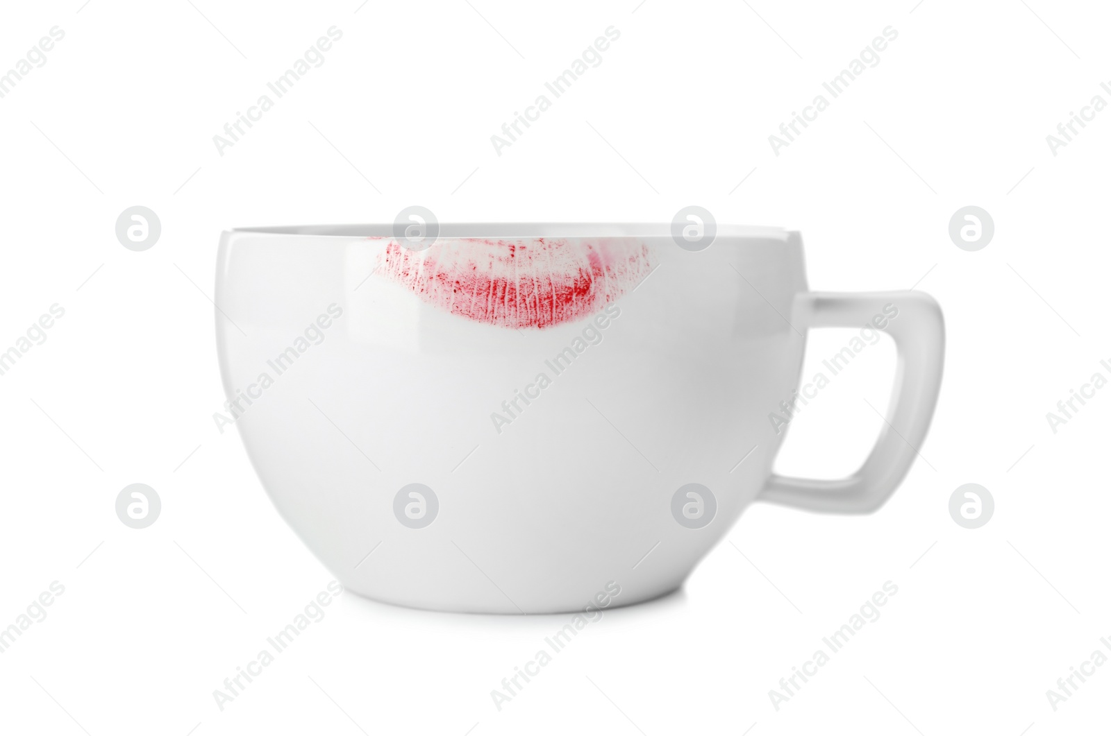 Photo of Ceramic cup with lipstick mark on white background