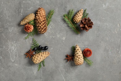 Photo of Flat lay composition with pinecones on grey background