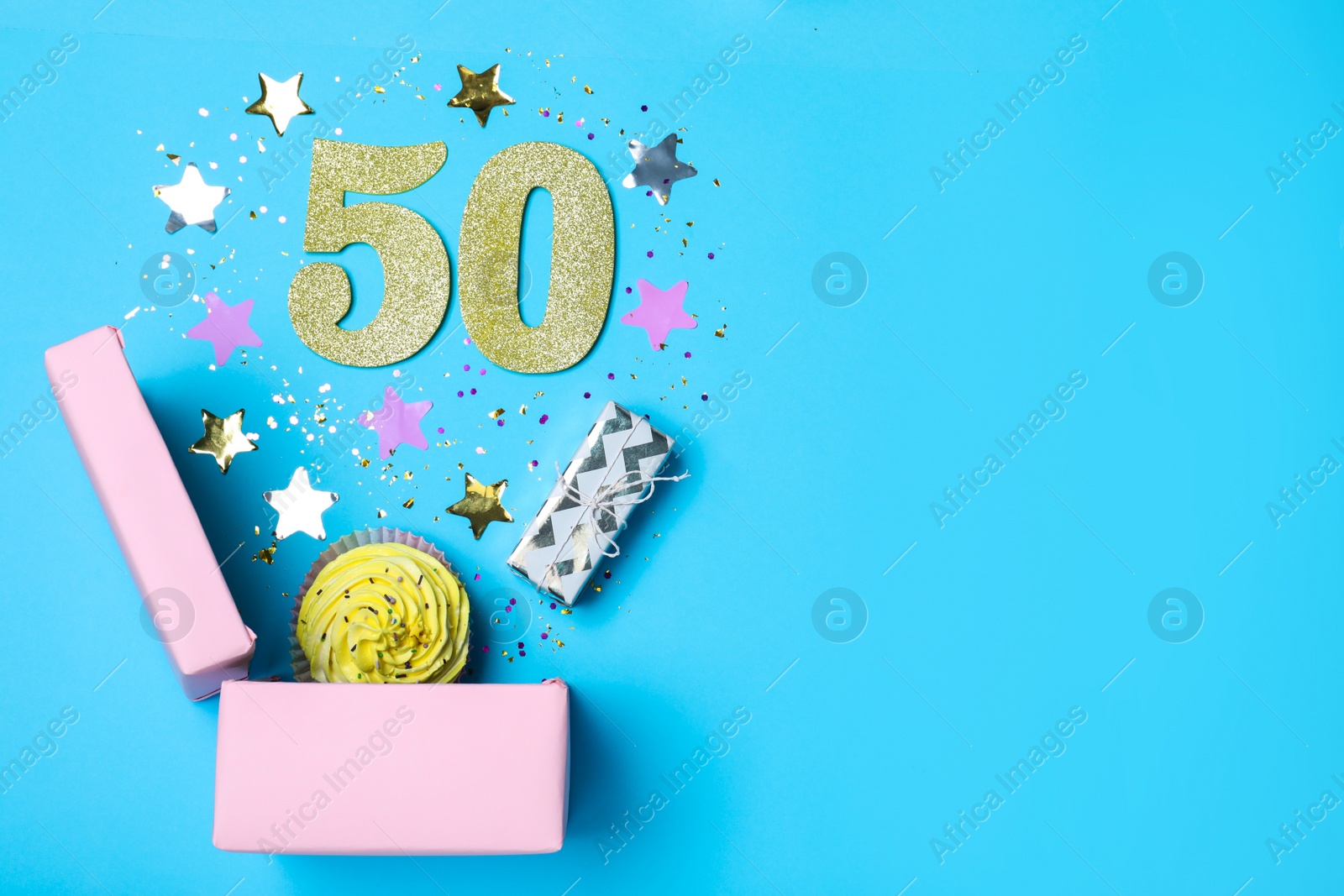 Photo of Flat lay composition with decor and numbers on light blue background, space for text. 50th birthday party