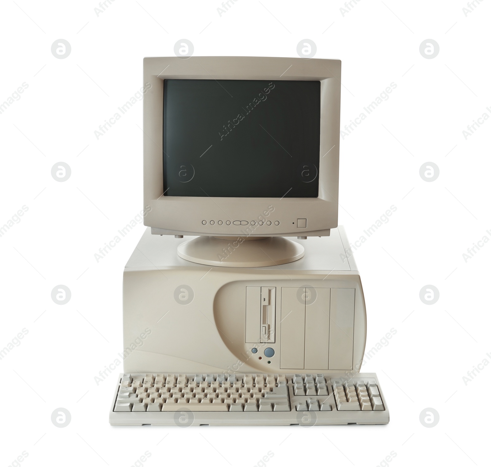 Photo of Old computer monitor, keyboard and system unit on white background