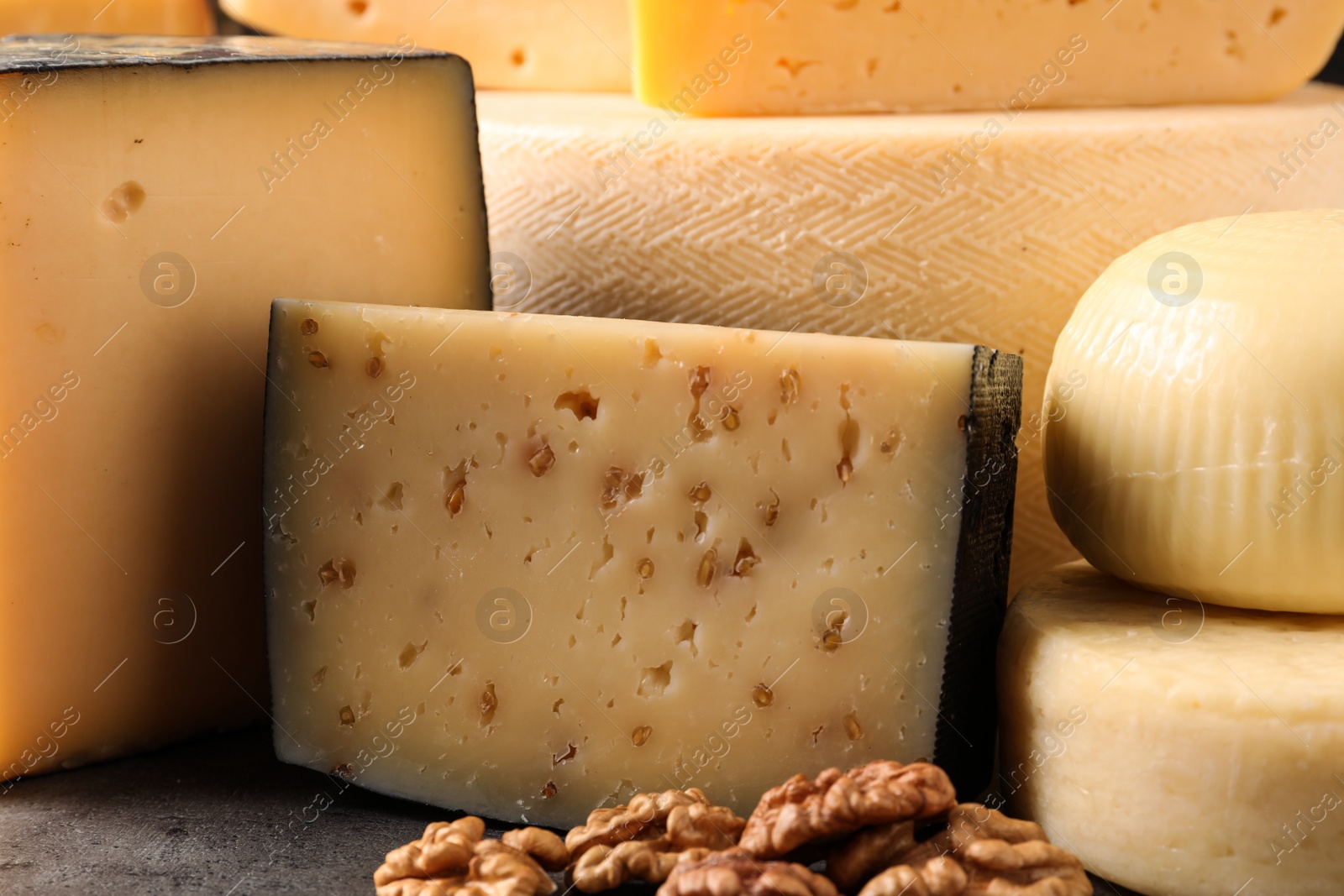 Photo of Different types of delicious cheese on table, closeup