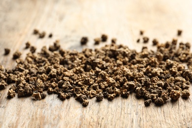 Raw beet seeds on wooden background, closeup. Vegetable planting