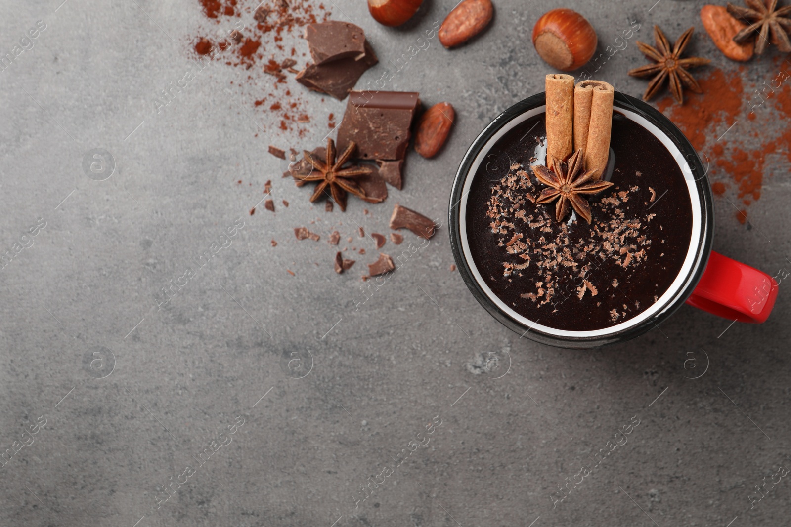 Photo of Flat lay composition with yummy hot chocolate on grey table. Space for text