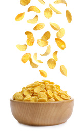 Image of Tasty crispy corn flakes falling into bowl on white background