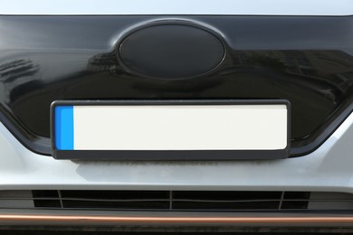 Car with vehicle registration plate, closeup view