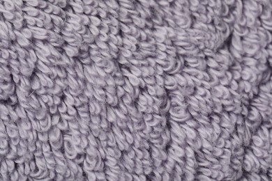 Photo of Texture of soft violet fabric as background, top view