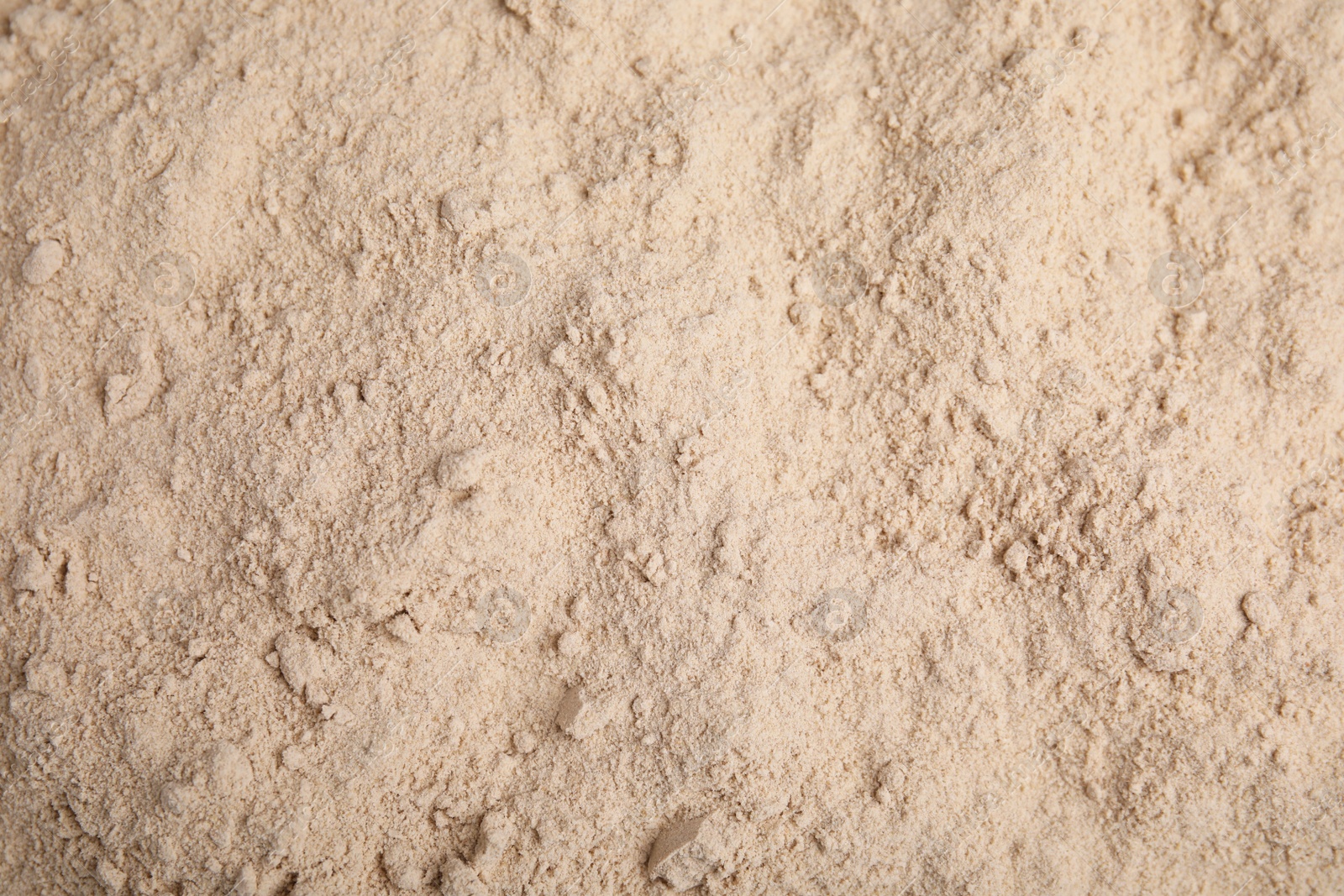 Photo of Pile of buckwheat flour as background, top view