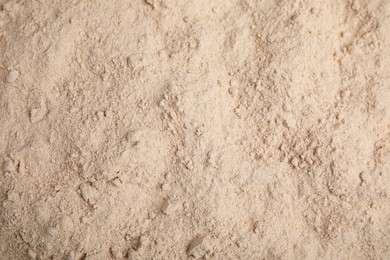 Photo of Pile of buckwheat flour as background, top view