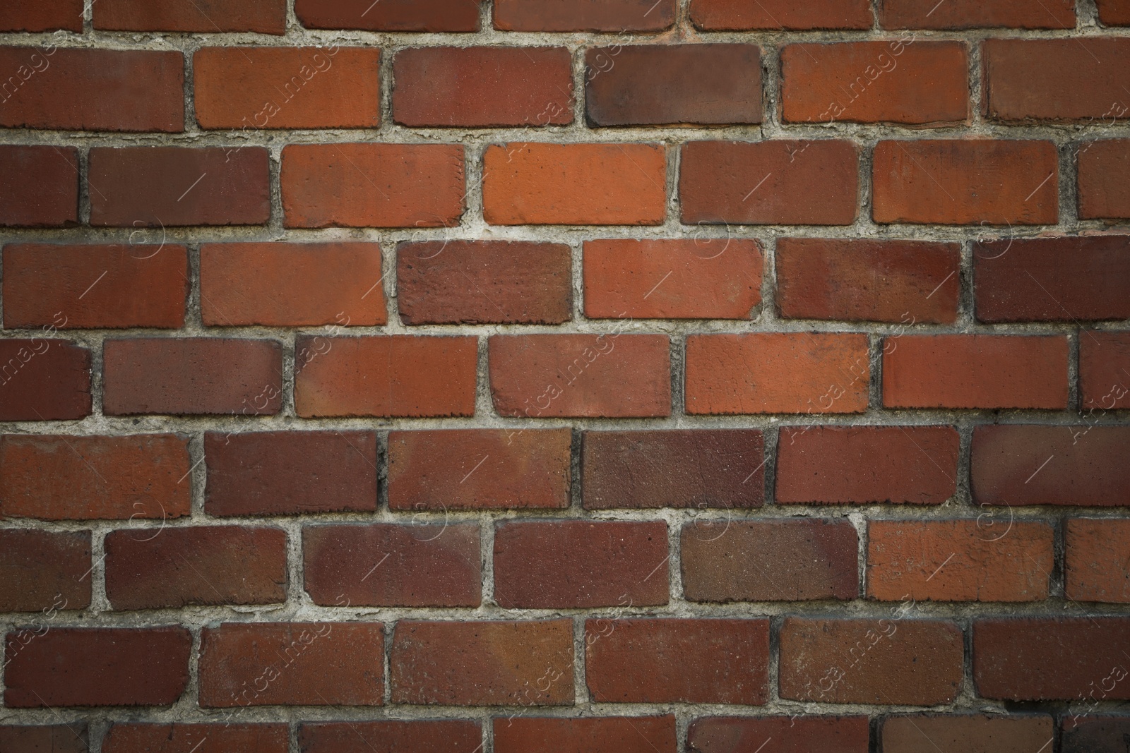 Photo of Texture of red stone wall as background, closeup