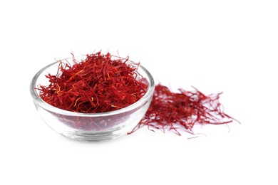 Photo of Dried saffron and glass bowl on white background