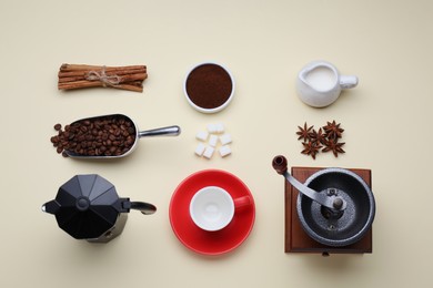 Photo of Flat lay composition with vintage manual coffee grinder and spices on beige background