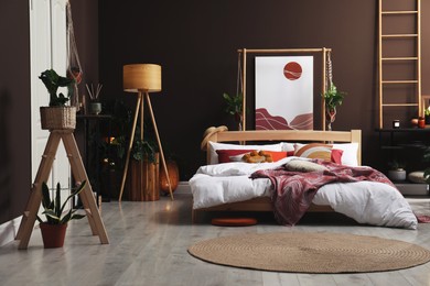 Photo of Modern interior of stylish room with large comfortable bed